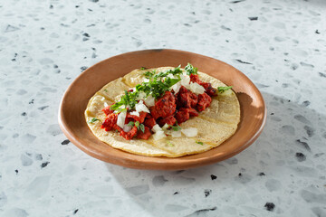 A view of an al pastor street taco.