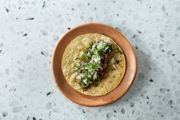 A top down view of a ground beef street taco.