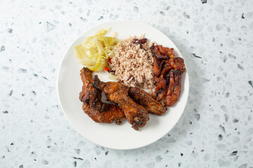 A top down view of a plate of jerk chicken wings.