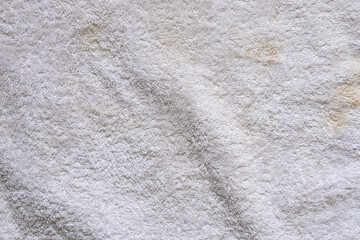 White dirty terry towel with stains as background