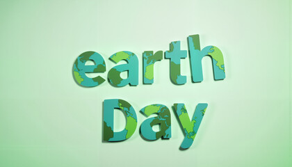 Fototapeta premium Earth Day message displayed creatively against a minimalist background, environmental awareness