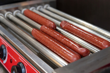 Sausages on automatic electric grill