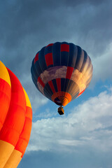 Obraz premium Colorful balloons with bright colors of the domes at the sky with clouds