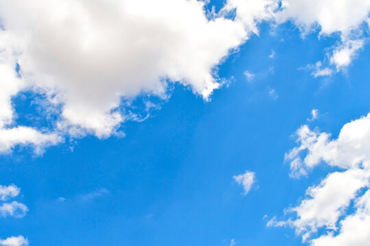 Blue sky with white fluffy cloud. Cumulus clouds background. Cloudscape morning sky. The concepts of freedom of live, never give up and positive though energy.