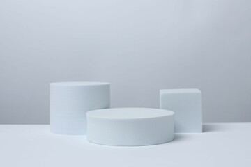 White podiums on a light background