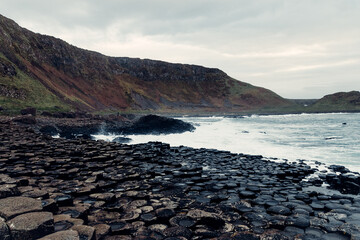 Storm Waves Crash Against the Giant’s Causeway Rocks with Dark Skies	