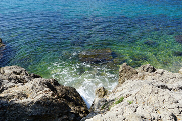 Aerial view to the blue and turquoise sea in sea bay in Croatian seacoast