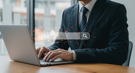 SEO optimization Businessman searching SEO keywords on laptop sharp focus on hands typing with a