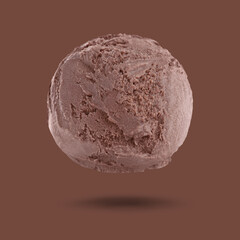 Fototapeta premium Ice cream scoop in air on brown background. Yummy dessert