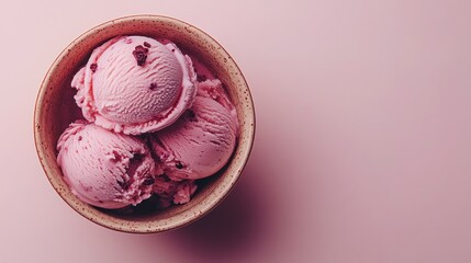 Pink ice cream scoops in a bowl