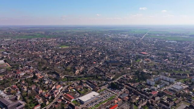 Historic French town of Beaune surrounded by fresh greenery. Aerial drone video