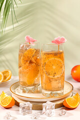 Detox diet and weight loss concept. Diet vegan cocktail with chia seeds, orange, lime, violet and ice. Summer party and healthy lifestyle advertisement. Summer banner and screen template.