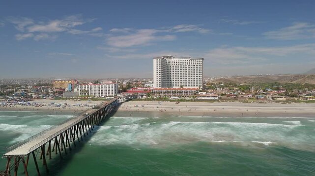 Aerial Drone View of Broken Rosarito Pier and Beachfront Resort in Baja California, Mexico