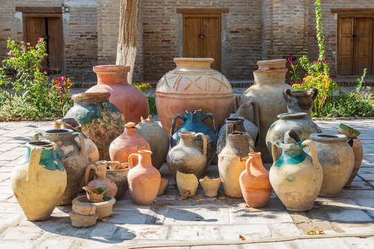 Bukhara, Uzbekistan, Central Asia. Variety of pots in a courtyard in Bukhara.