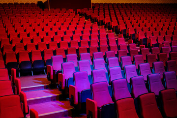 Obraz premium mpty seats in the theater, cinema. red chairs. empty seats background