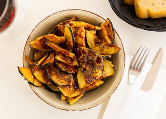 Plate with prepared food eggplants with honey closeup
