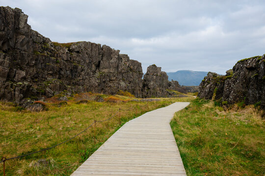 Thingvellir National Park, Iceland. Wooden boardwalk thorough landscape in park.