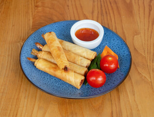 Thai King Prawn Spring Rolls comes with chilli sauce.