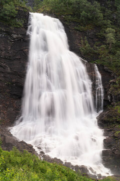Norway. Fossen Bratte waterfall cascades down cliff.