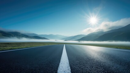 View from the side of a deserted asphalt road and cloudy mountains behind.