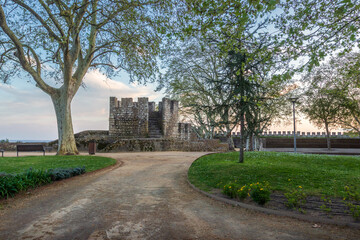 Portas do Sol garden in Santarém, Portugal, with the castle walls that delimit it in the...