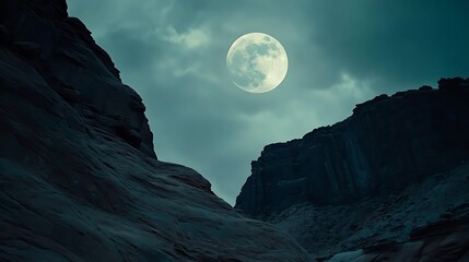 Rocky canyon under a full moon