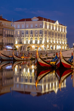 Gondola style fishing tour boats in canal in Aveiro, Portugal