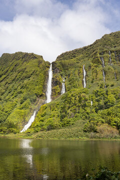 Azores, Portugal. Waterfall dropping into Lagoa dos Patos on Flores Island.