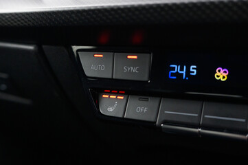 Obraz premium Close-Up of Heated Seat Button in Car Interior