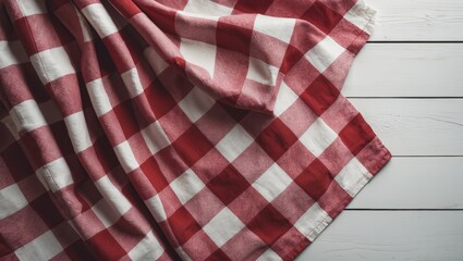 Top view of a wooden table with a red checkered tablecloth