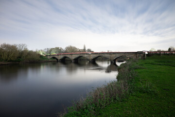 Fototapeta premium Willington Bridge Crossing the River Trent in Derbyshire
