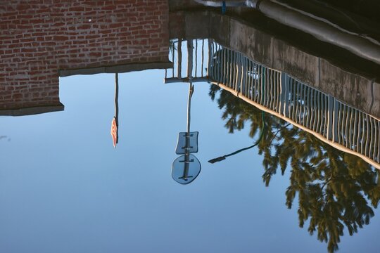 Water surface reflecting a street above