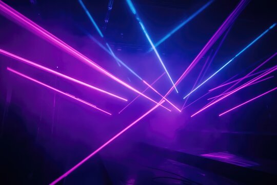 Intersecting pink and blue laser beams create a vibrant, dynamic, and futuristic light show.