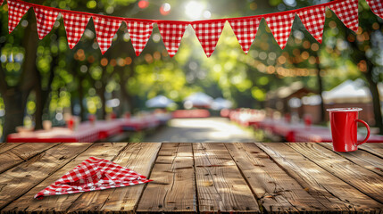Wooden picnic table with red checkered decorations