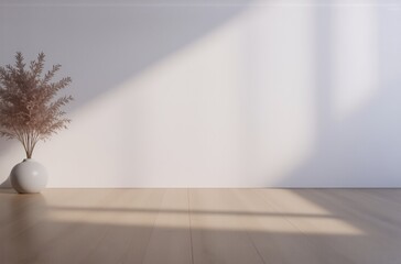 Sunlight streams into a minimalist room, illuminating a light wood floor and a dried pampas grass arrangement in a white vase against a blank wall.  The scene evokes serenity and calm.