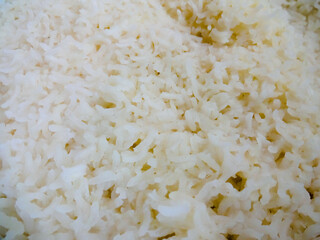 Healthy food. Wooden bowl with parboiled rice on white background. Top view, copy space, high resolution product.