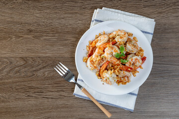 Fried shrimp with garlic and pepper on white plate - seafood style