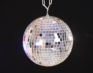 One shiny disco ball on dark background