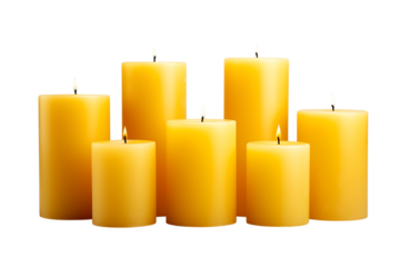 A group of six yellow pillar candles of varying heights on a  transparent background with some lit flames png