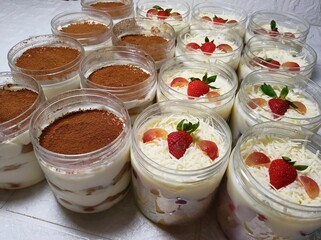 Refreshing fruit salads and rich tiramisu served in clear jars