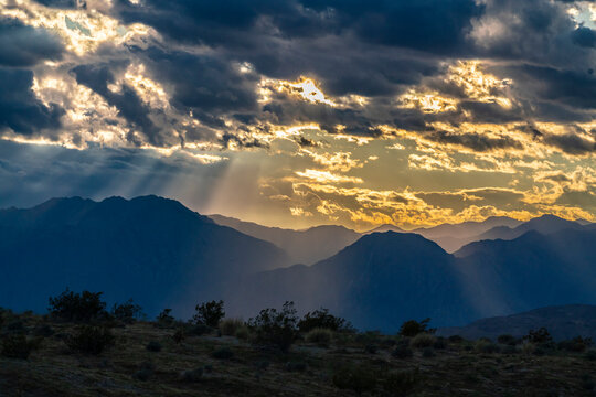 USA, California, Anza Borrego Desert State Park. God rays over mountains at sunset.