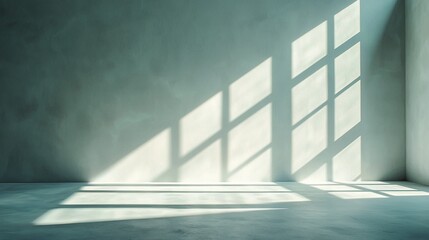 Fototapeta premium Empty room bathed in sunlight; shadows of a window grace the wall and floor
