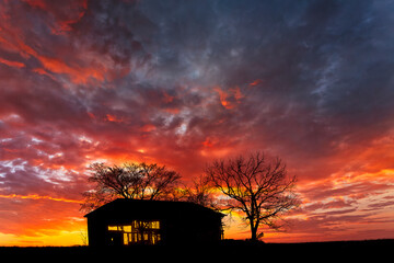 Old abandoned Kentucky tobacco barn at sunrise, near Lexington, Kentucky