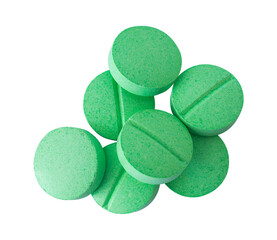 green pills on white background