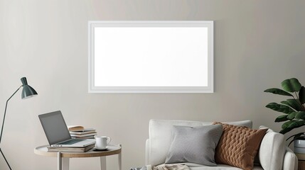 A white rectangular frame mounted in a living room above a small side table with a cup, a laptop,  HD 8K wallpaper Photographic Image
