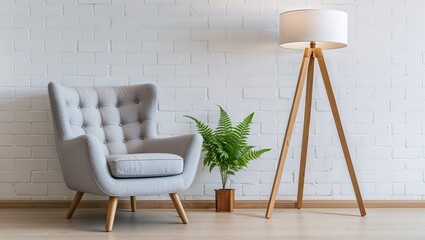 a minimalist interior design photograph featuring a modern, light gray armchair with wooden legs positioned on the left side.