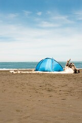 Small Blue Tent on Whatipu Beach &ndash; Tranquil Camping Scene in New Zealand