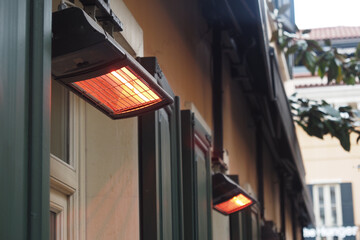 Outdoor heaters providing warmth on a chilly evening in a cozy space