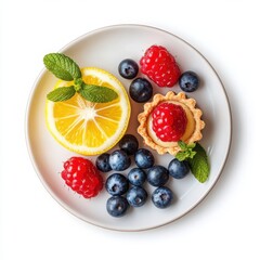 Mini tart assortment with lemon and mixed berry toppings, on white.