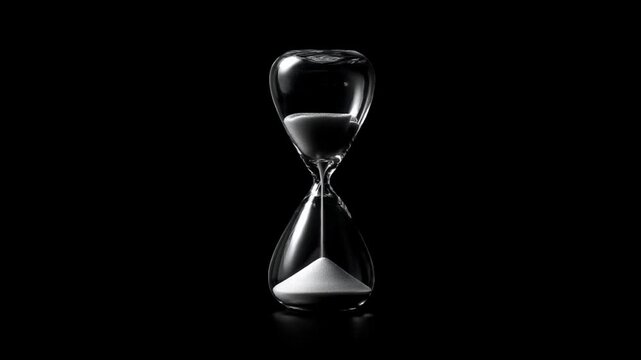 Time Passing: An hourglass against a black background, with sand slowly dripping, symbolizing the passage of time, deadlines, and the fleeting nature of moments.